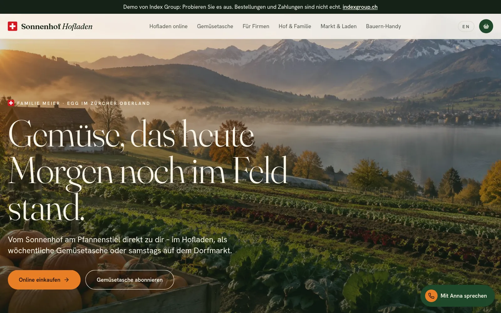 Home page of the Sonnenhof Farm Shop demo: vegetable fields in front of a lake and mountains
